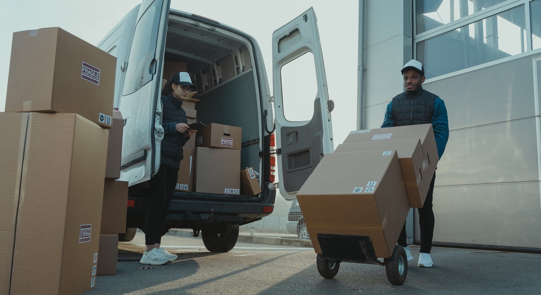 a man and a woman working for a delivery company