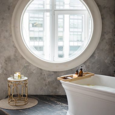 interior of modern bathroom with round window